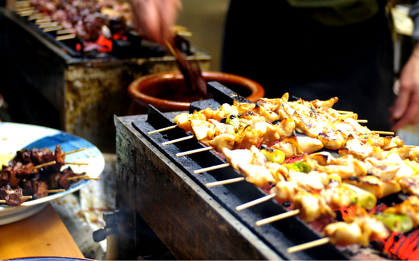 Street food in Tokyo, Japan 9 Tips To Travel Internationally On A Budget